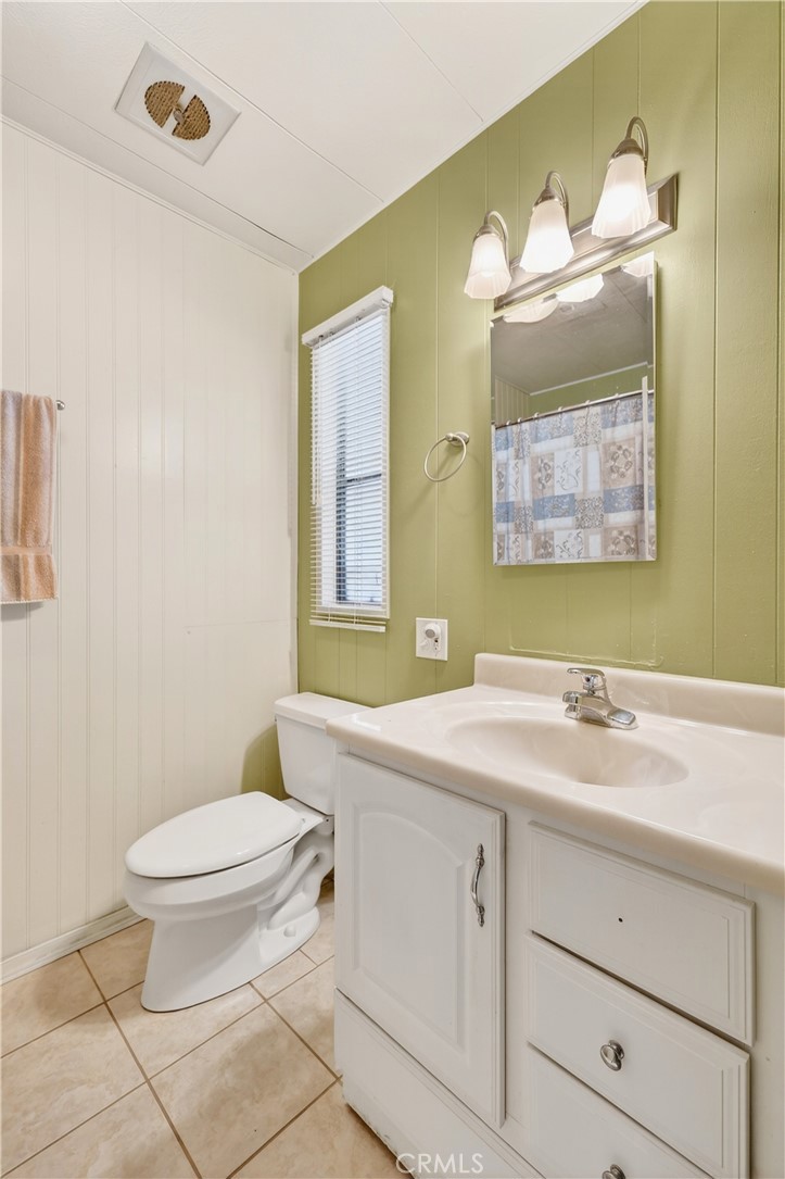 1001 East Lambert Road, Unit 258 La Habra, CA 90631 - Photo 27 of 75 a bathroom with a sink a toilet and mirror