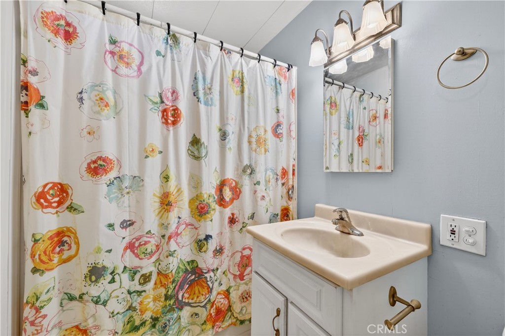 1001 East Lambert Road, Unit 258 La Habra, CA 90631 - Photo 30 of 75 a bathroom with a sink and a mirror
