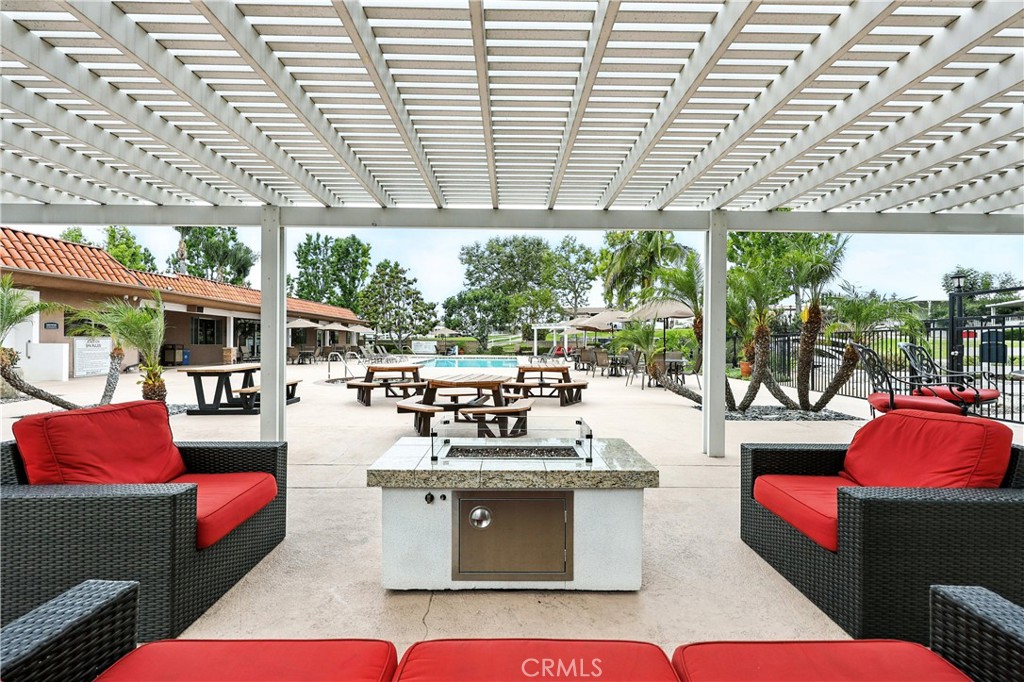 1001 East Lambert Road, Unit 258 La Habra, CA 90631 - Photo 54 of 75 a living room with patio furniture and a floor to ceiling window