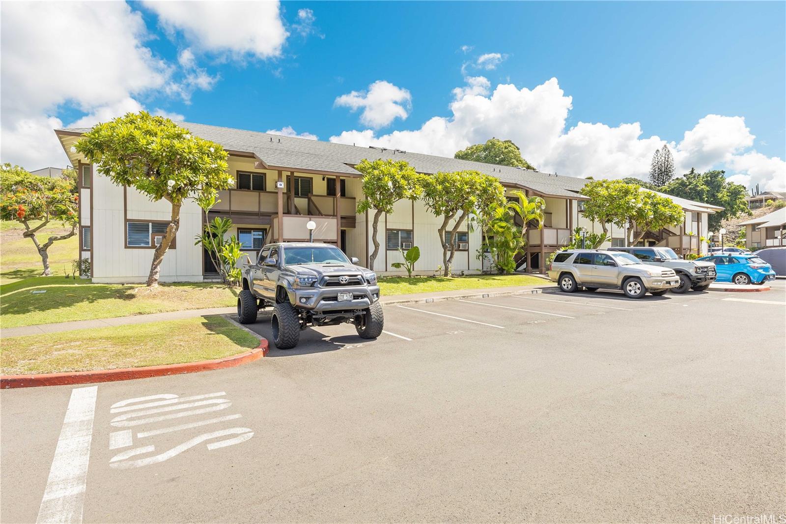1233 Ala Alii Street, Unit 5 Honolulu, HI 96818 - Photo 12 of 16 a view of a cars park in front of a building