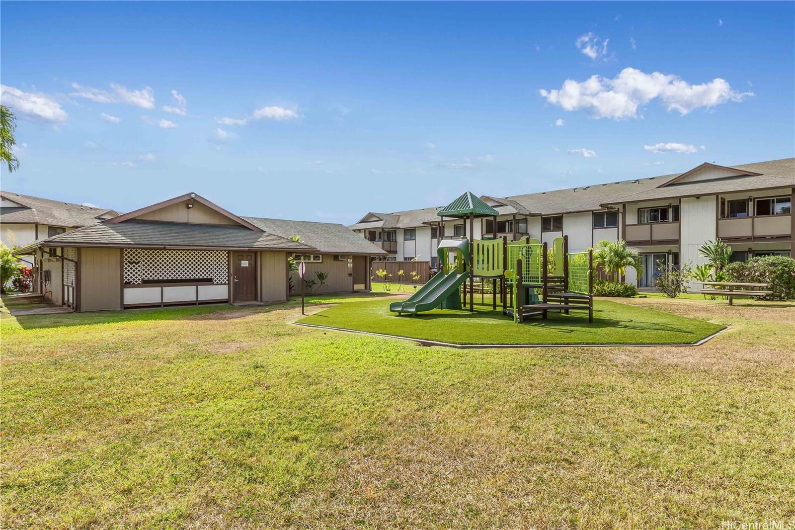 1233 Ala Alii Street, Unit 5 Honolulu, HI 96818 - Photo 16 of 16 a view of a big house with a big yard and large trees
