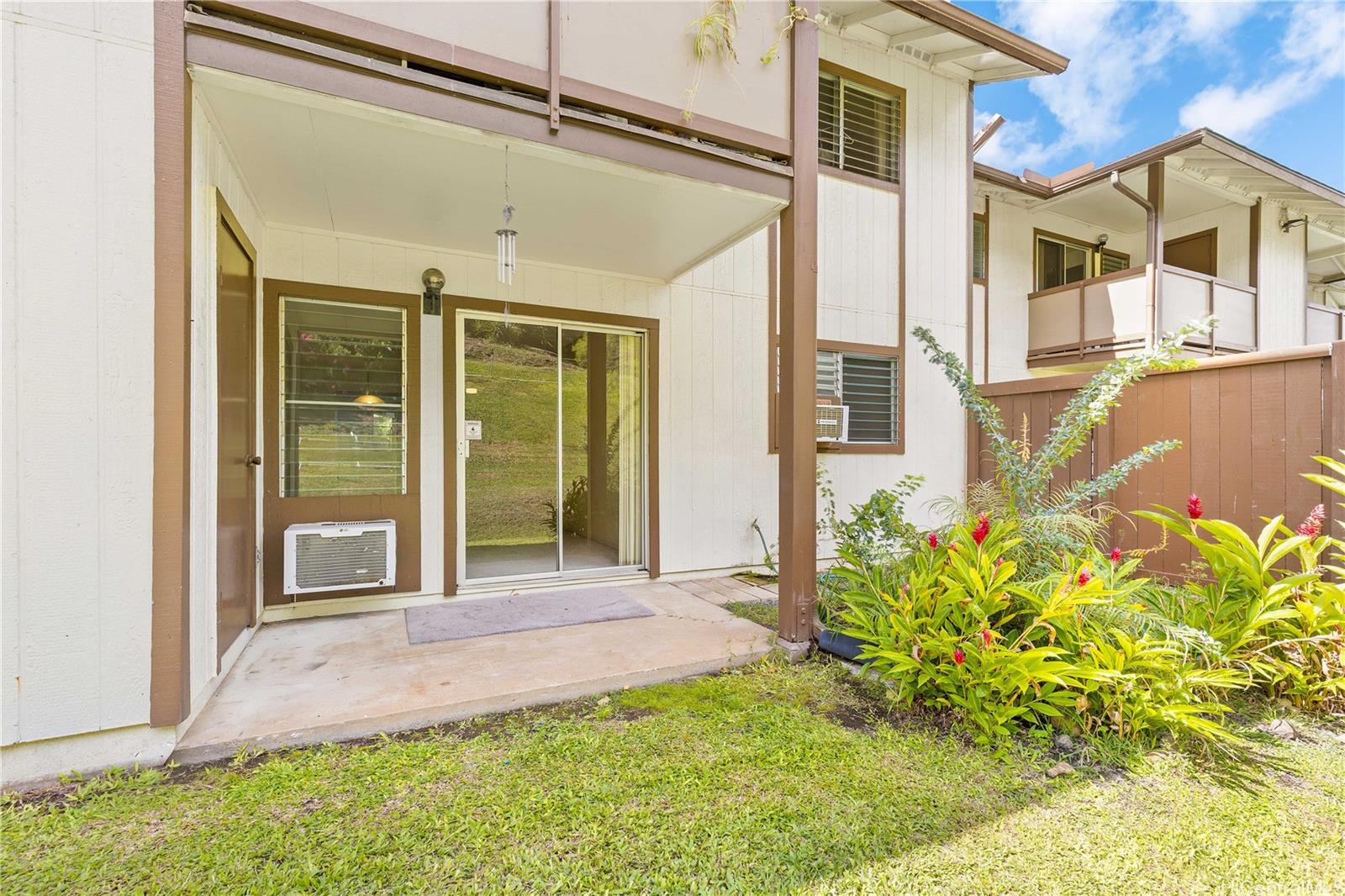 1233 Ala Alii Street, Unit 5 Honolulu, HI 96818 - Photo 9 of 16 a front view of a house with a big yard