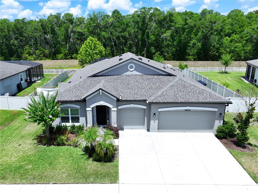 18078 Romanesque Court Spring Hill, FL 34610 - Photo 79 of 81 a house view with a garden space
