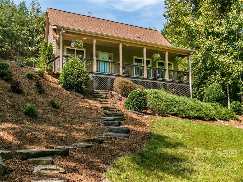 1964 Parkway North Rd Mill Spring Mill Spring, NC 28756 - Photo 2 of 19 a view of a house with backyard and garden