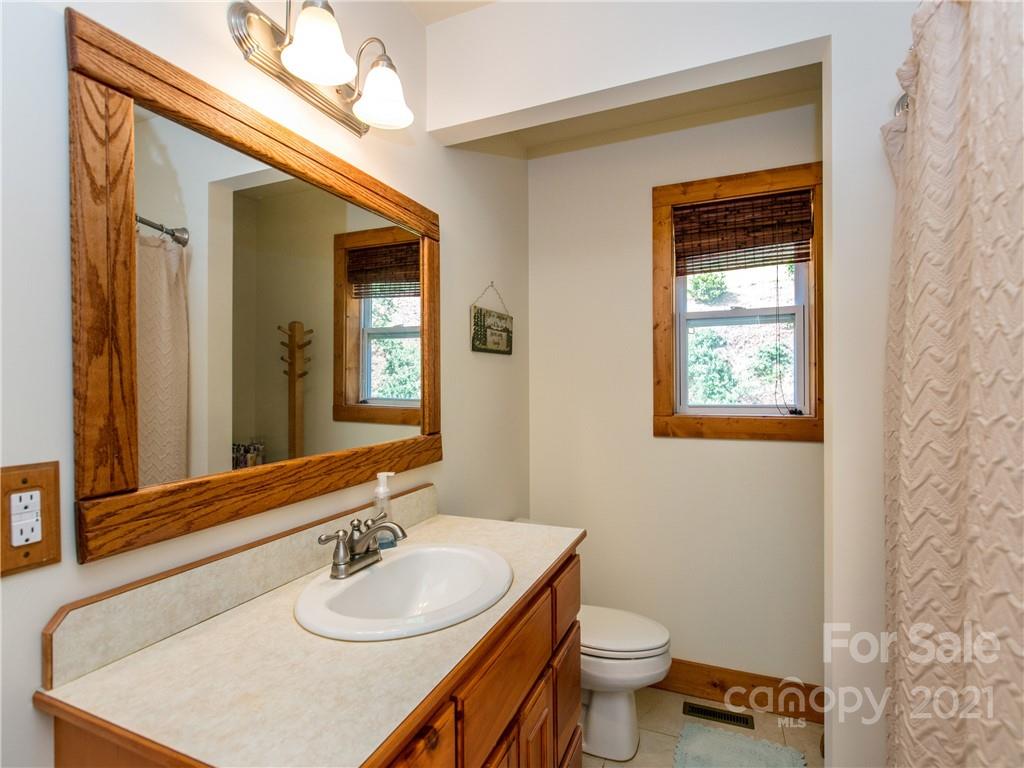 1964 Parkway North Rd Mill Spring Mill Spring, NC 28756 - Photo 13 of 19 a bathroom with a sink and a toilet