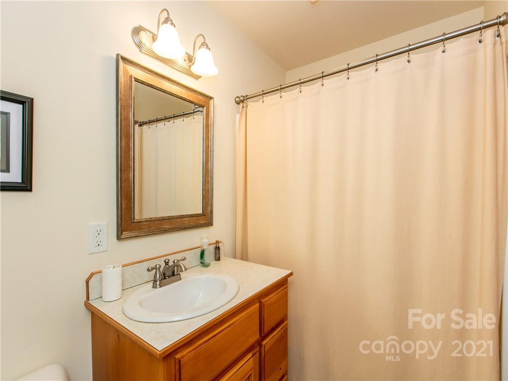 1964 Parkway North Rd Mill Spring Mill Spring, NC 28756 - Photo 15 of 19 a bathroom with a sink and a mirror