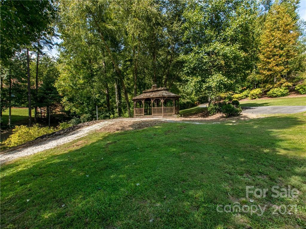1964 Parkway North Rd Mill Spring Mill Spring, NC 28756 - Photo 19 of 19 a view of a house with a big yard