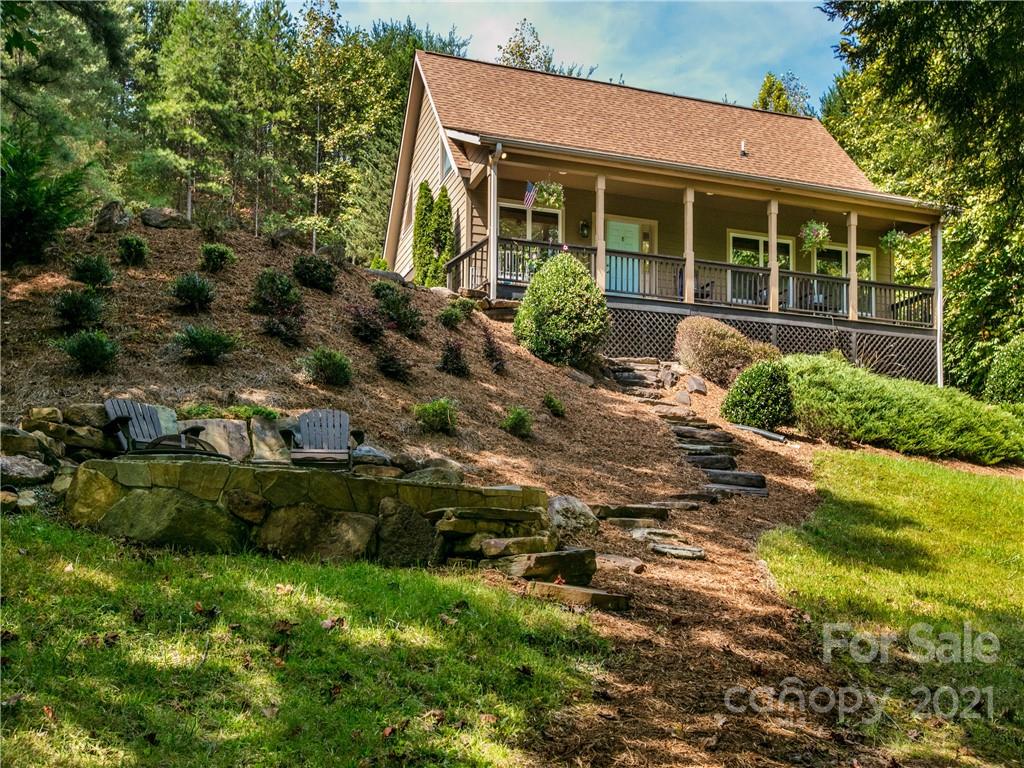 1964 Parkway North Rd Mill Spring Mill Spring, NC 28756 - Photo 3 of 19 a front view of house with yard and green space