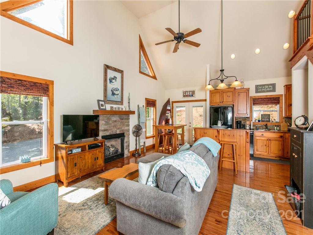 1964 Parkway North Rd Mill Spring Mill Spring, NC 28756 - Photo 6 of 19 a living room with fireplace furniture and a flat screen tv