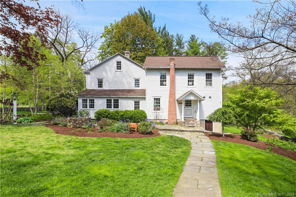 48 Crawford Road Westport, CT 06880 - Photo 1 of 1 a front view of a house with a yard