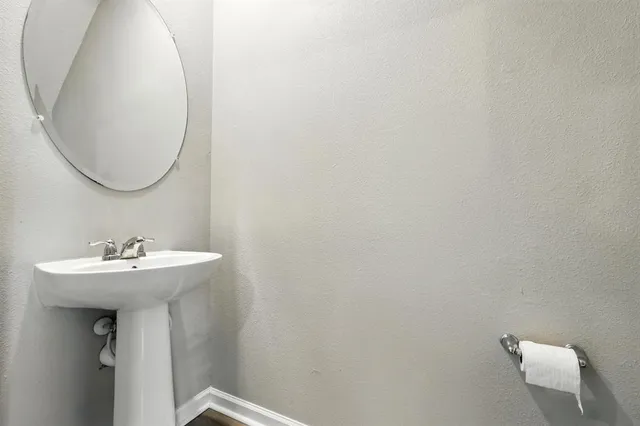 a bathroom with a toilet a sink and a bathtub