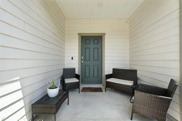 a porch with outdoor seating