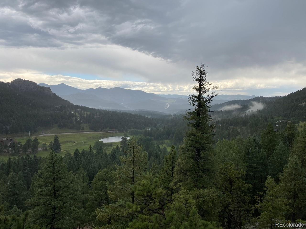 25756 Zugspitz Road Evergreen, CO 80439 - Photo 4 of 31 a view of a town with mountains in the background