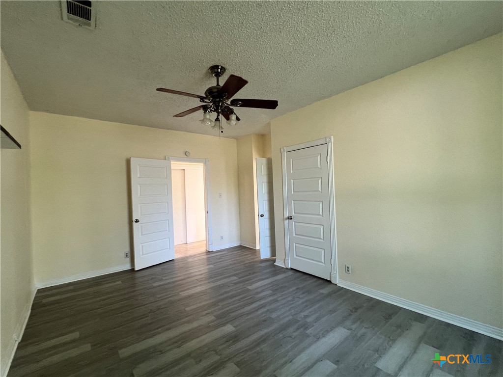 902 North 1st Street Temple, TX 76501 - Photo 12 of 29 a view of an empty room with wooden floor and a window