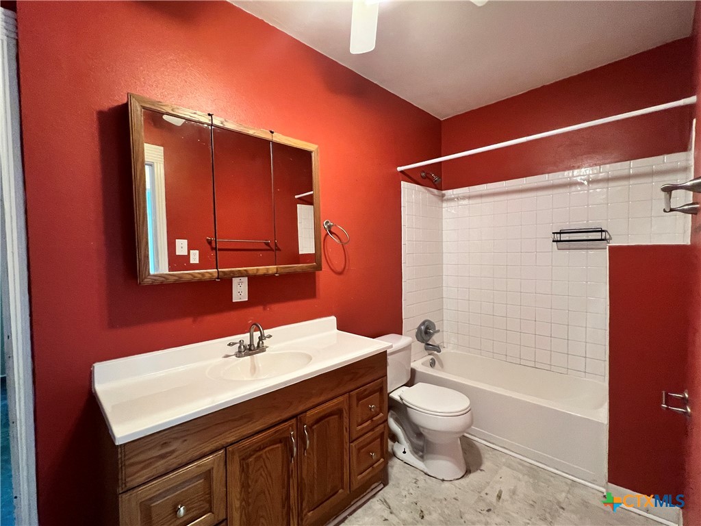 902 North 1st Street Temple, TX 76501 - Photo 14 of 29 a bathroom with a sink a toilet and shower