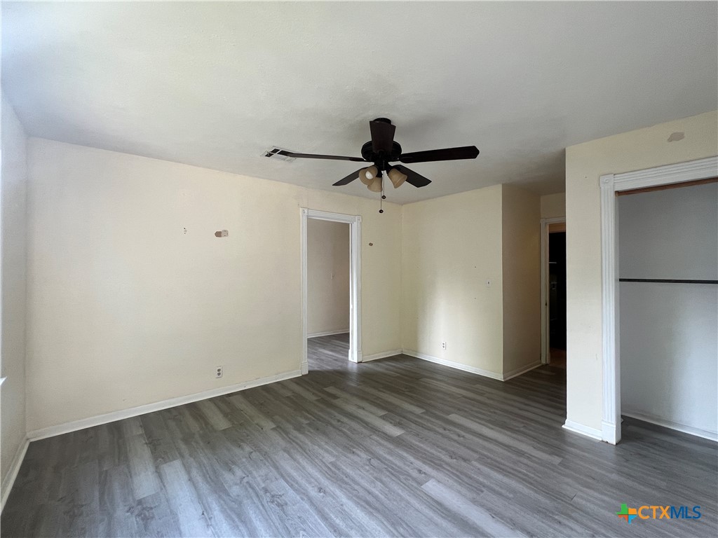 902 North 1st Street Temple, TX 76501 - Photo 16 of 29 a view of empty room with wooden floor