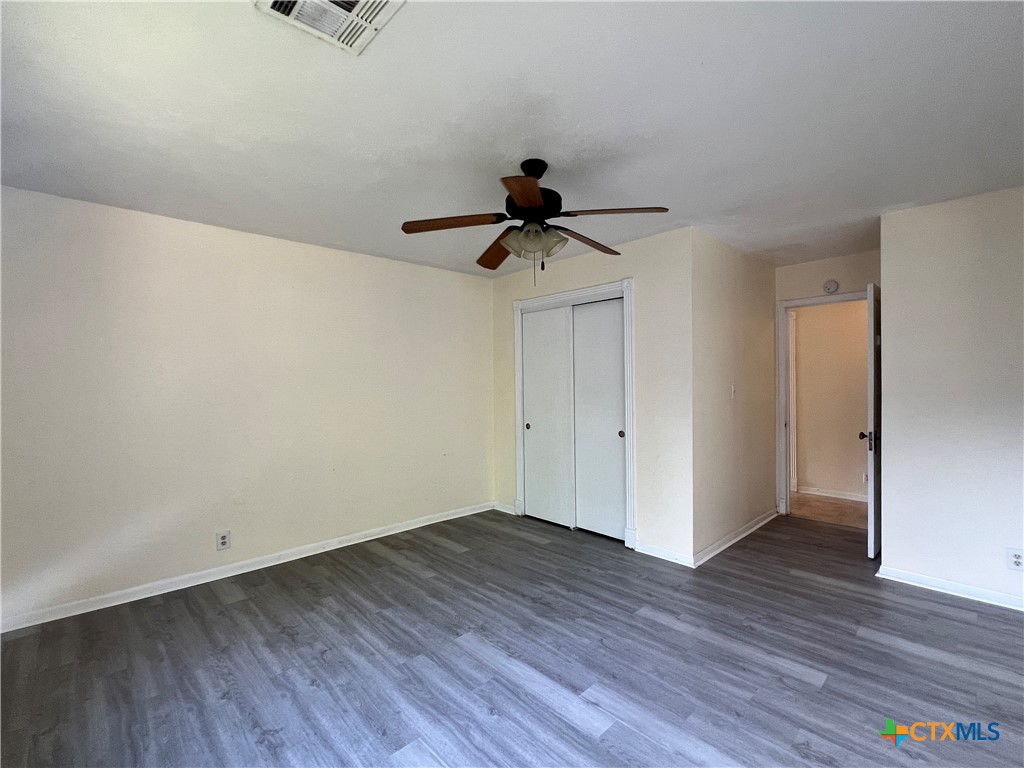 902 North 1st Street Temple, TX 76501 - Photo 18 of 29 a view of empty room with wooden floor