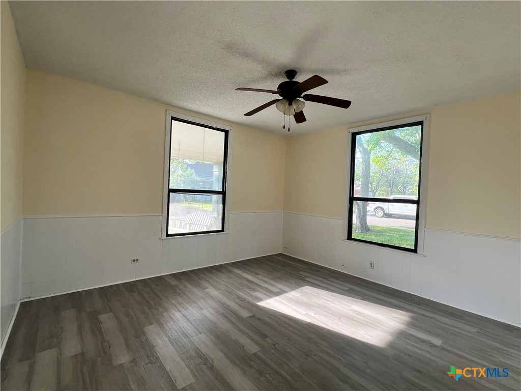 902 North 1st Street Temple, TX 76501 - Photo 21 of 29 a view of empty room with wooden floor and fan