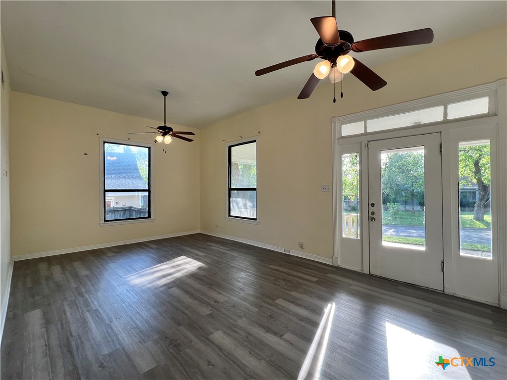 902 North 1st Street Temple, TX 76501 - Photo 23 of 29 a view of an empty room with wooden floor and a window