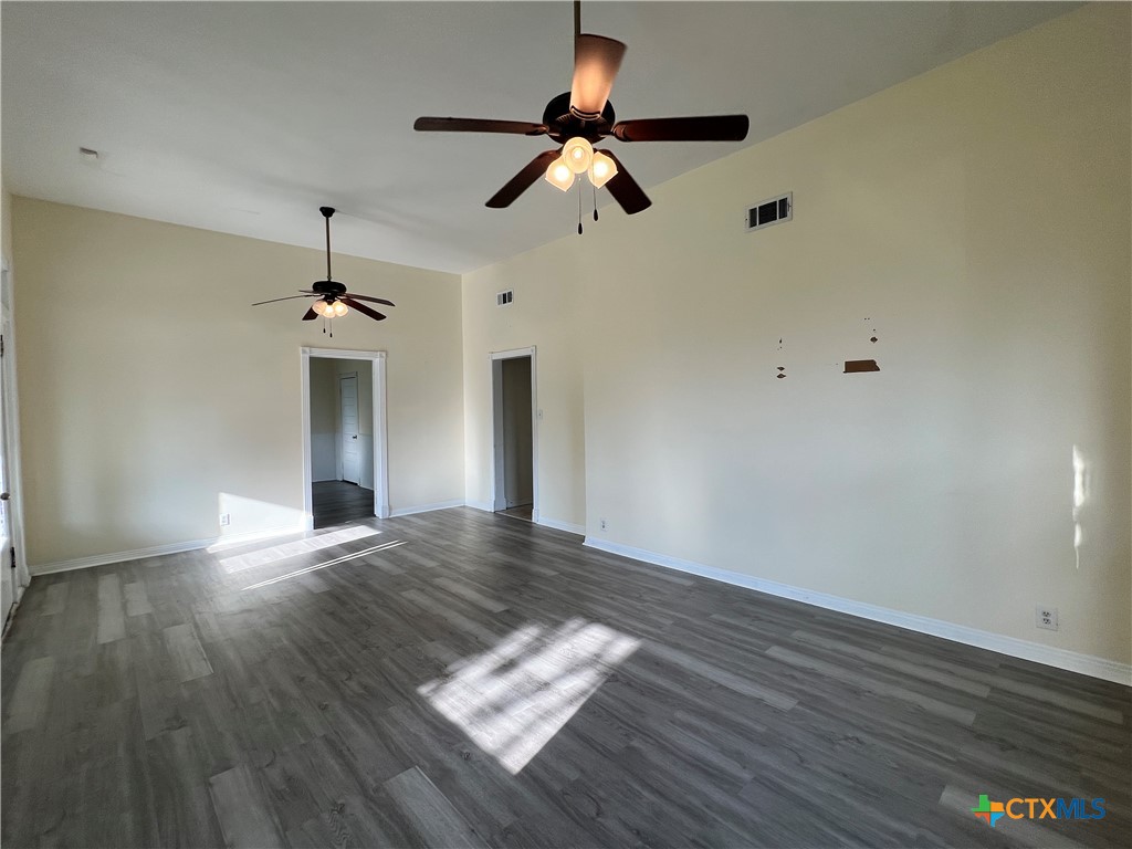 902 North 1st Street Temple, TX 76501 - Photo 26 of 29 a view of empty room with wooden floor and ceiling fan