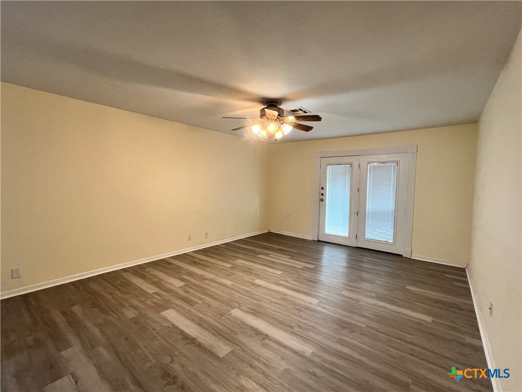 902 North 1st Street Temple, TX 76501 - Photo 4 of 29 a view of an empty room and wooden floor