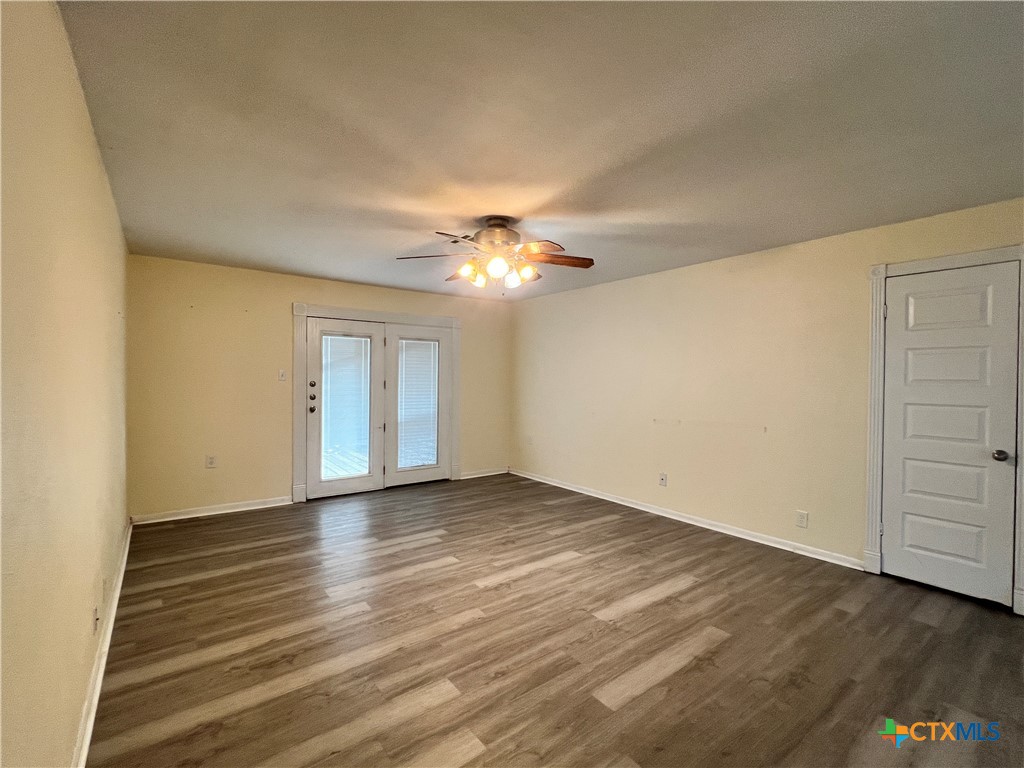 902 North 1st Street Temple, TX 76501 - Photo 5 of 29 a view of an empty room with wooden floor