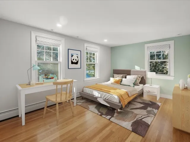 a bedroom with a bed and a table