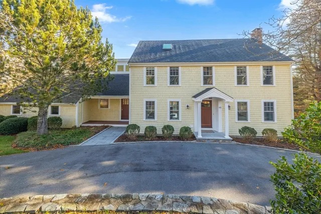 a front view of a house with a yard