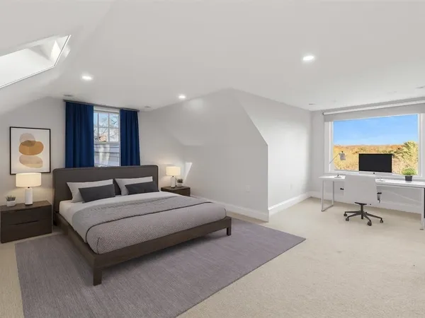 a bedroom with a bed and a couch