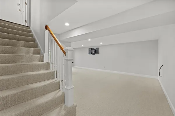 a view of an empty room with stairs