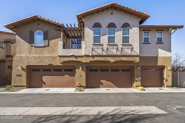 a front view of a house with a garage
