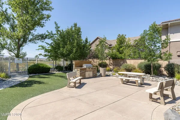 a view of a backyard with sitting area
