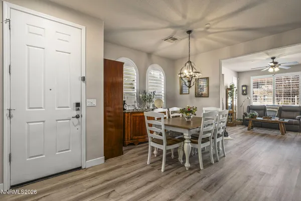 a view of a dining room with furniture window and wooden floor