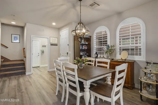 a view of a dining room with furniture window and wooden floor