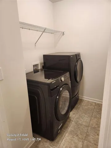 a view of an house with backyard and tree