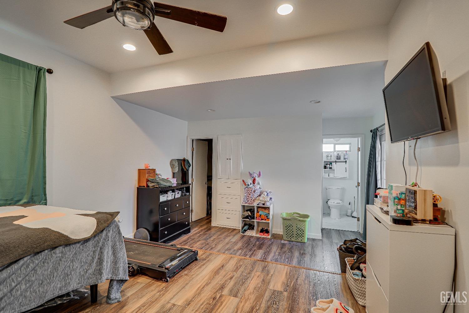 Undisclosed Address Bakersfield, CA 93304 - Photo 14 of 26 a bedroom with furniture and a flat screen tv