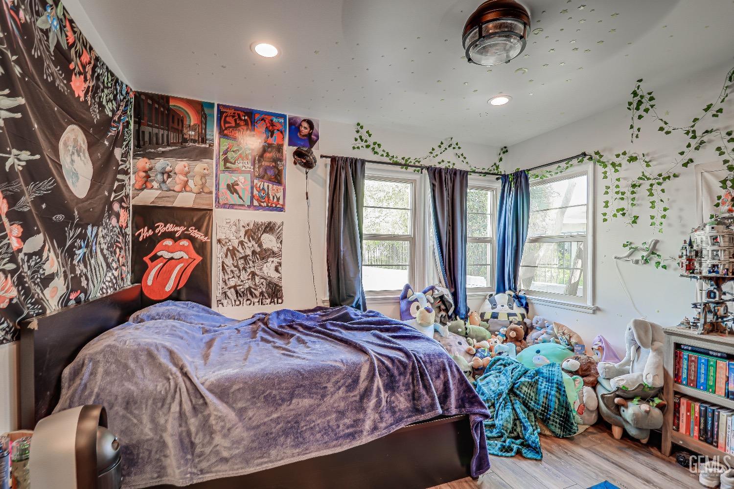 Undisclosed Address Bakersfield, CA 93304 - Photo 18 of 26 a bed sitting in a bedroom next to a window