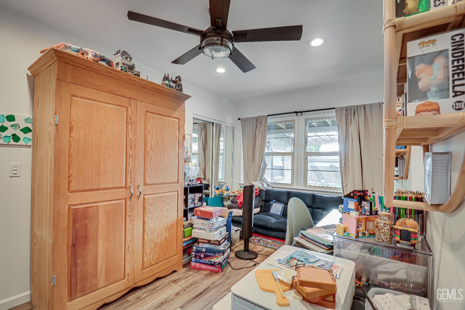 Undisclosed Address Bakersfield, CA 93304 - Photo 19 of 26 a room with furniture a rug and a window