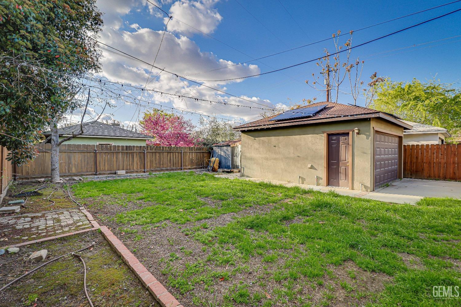 Undisclosed Address Bakersfield, CA 93304 - Photo 22 of 26 a view of a backyard with a garden