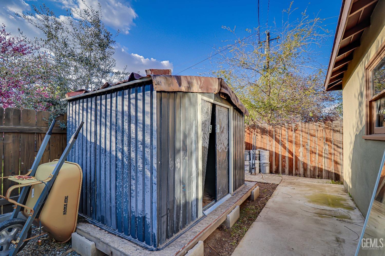 Undisclosed Address Bakersfield, CA 93304 - Photo 24 of 26 a view of a backyard with wooden fence