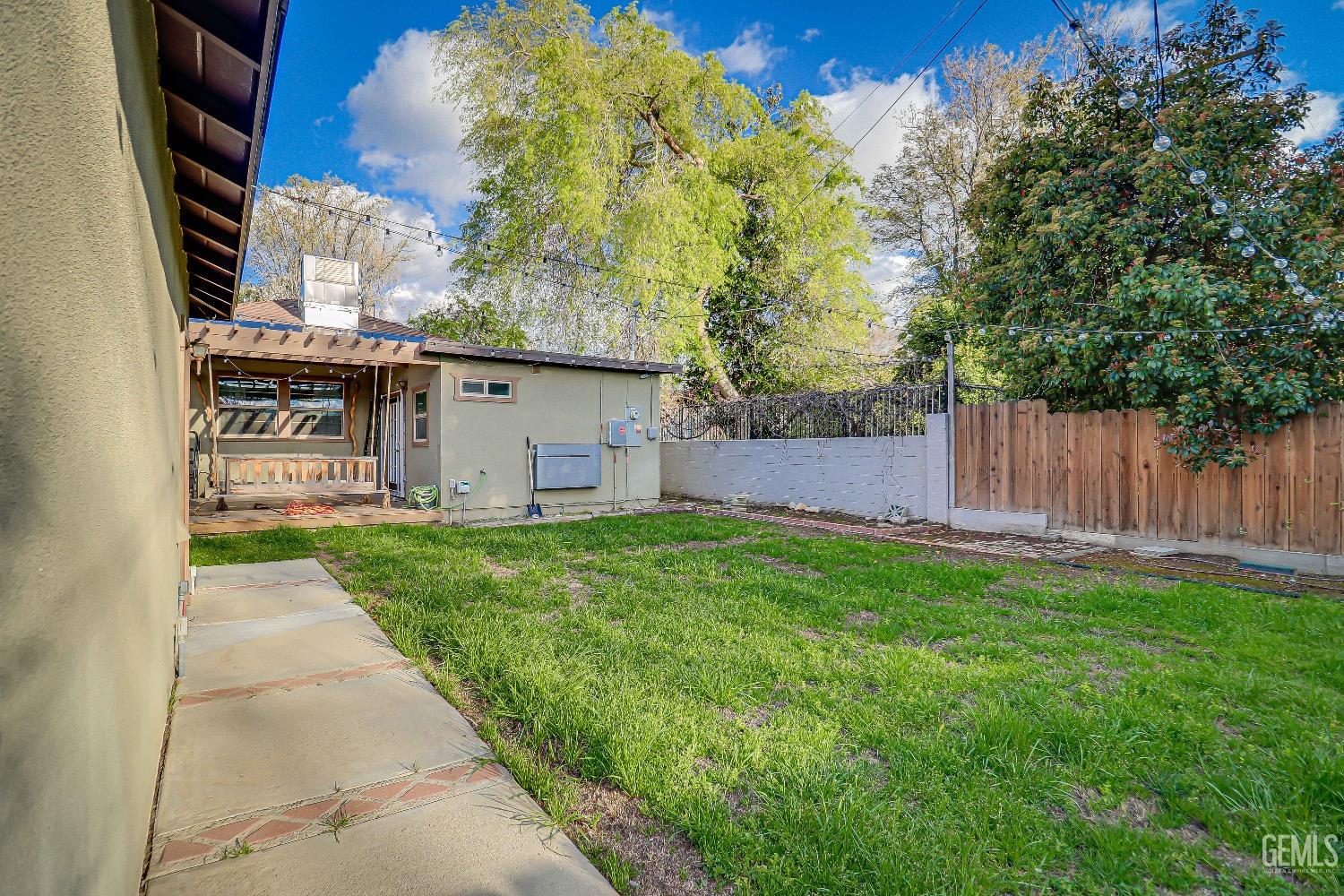 Undisclosed Address Bakersfield, CA 93304 - Photo 25 of 26 a view of a back yard of the house and green space