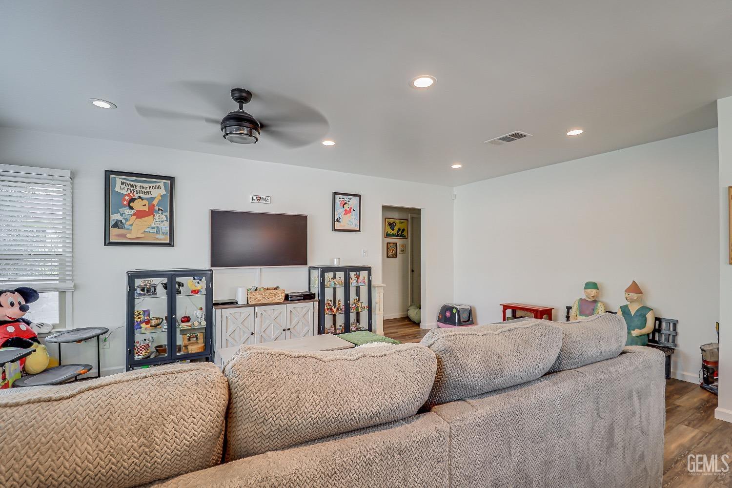 Undisclosed Address Bakersfield, CA 93304 - Photo 5 of 26 a living room with furniture and a flat screen tv