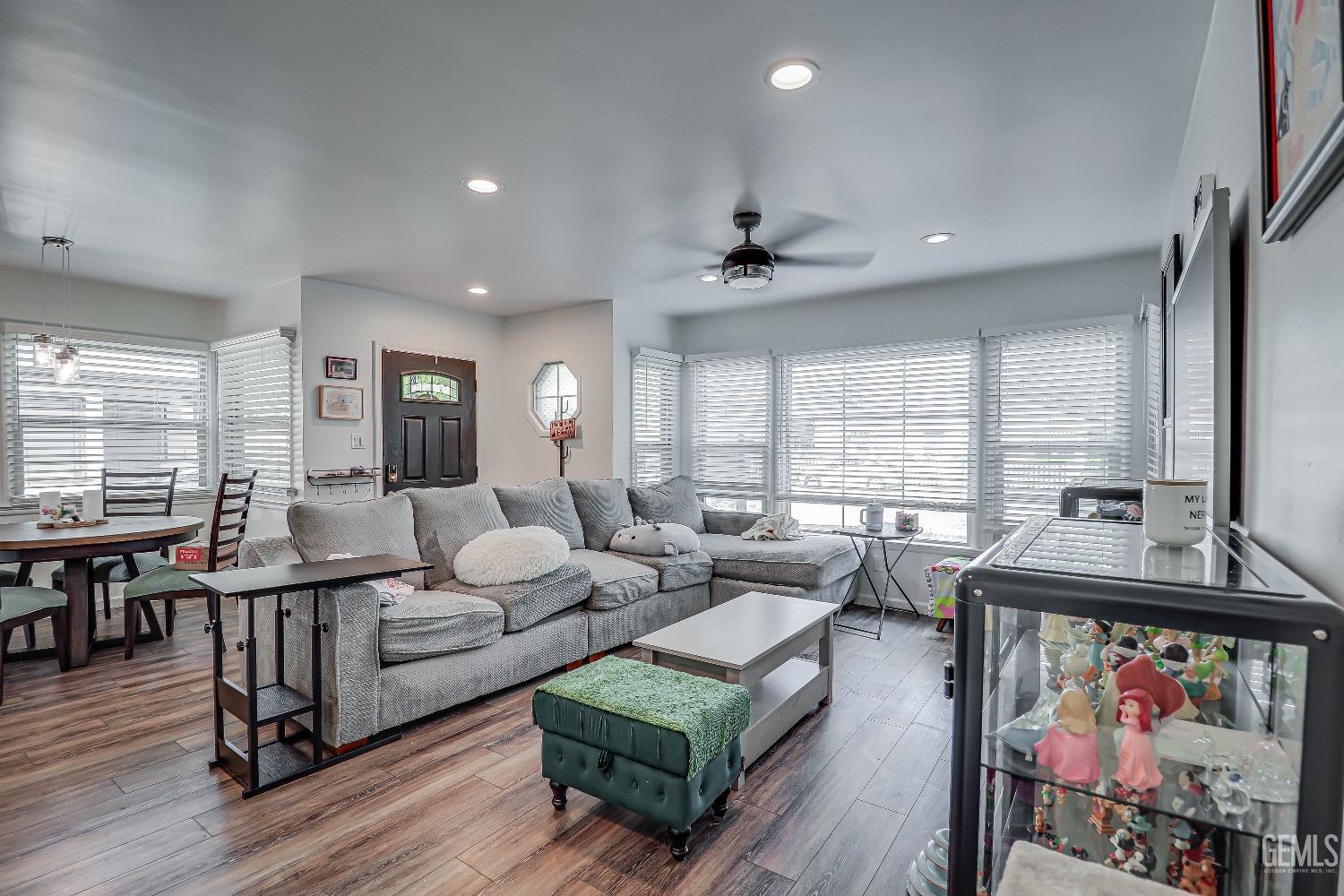 Undisclosed Address Bakersfield, CA 93304 - Photo 6 of 26 a living room with furniture and wooden floor