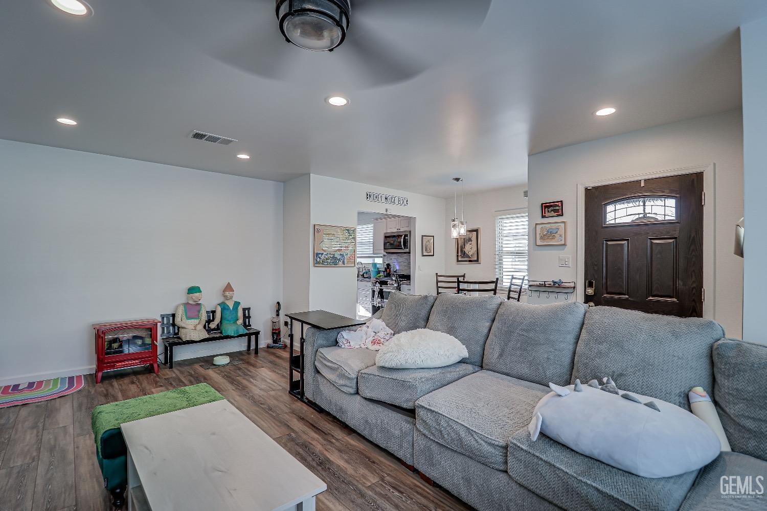 Undisclosed Address Bakersfield, CA 93304 - Photo 7 of 26 a living room with furniture and a table