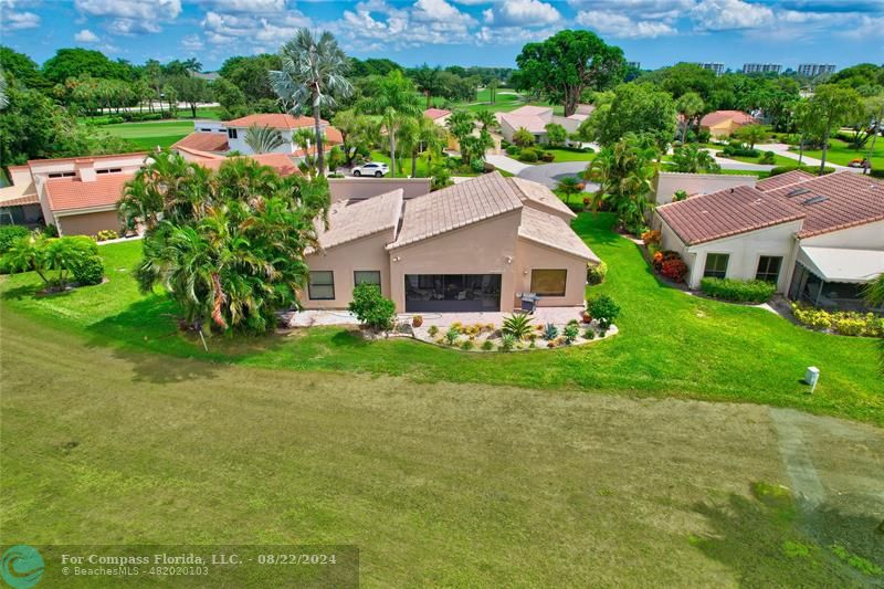 Boca West Boca Raton, FL 33434 - Photo 2 of 11 an aerial view of house with yard and mountain view in back
