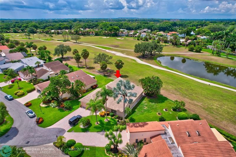 Boca West Boca Raton, FL 33434 - Photo 8 of 11 an aerial view of a house with a garden and lake view