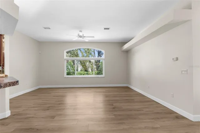 a kitchen with stainless steel appliances granite countertop a stove top oven a sink dishwasher and a microwave oven on the blue kitchen countertops