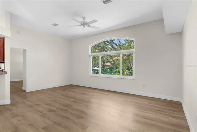 a kitchen with granite countertop a stove top oven microwave and cabinets