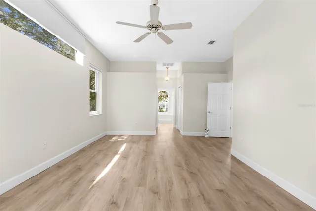 a spacious bathroom with a shower sink and mirror