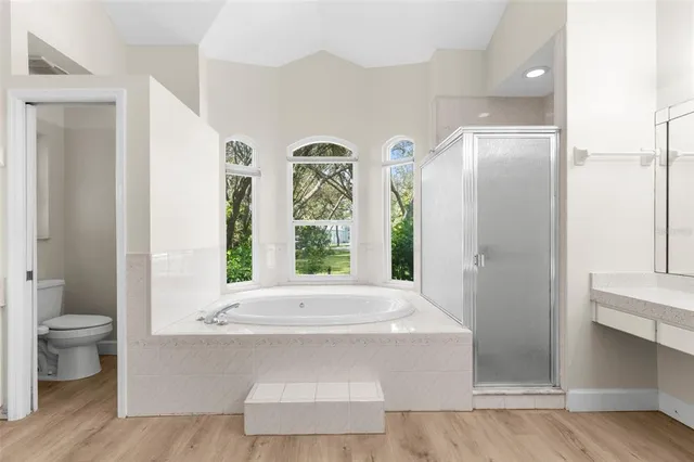 a bath tub sitting in a bathroom next to a window